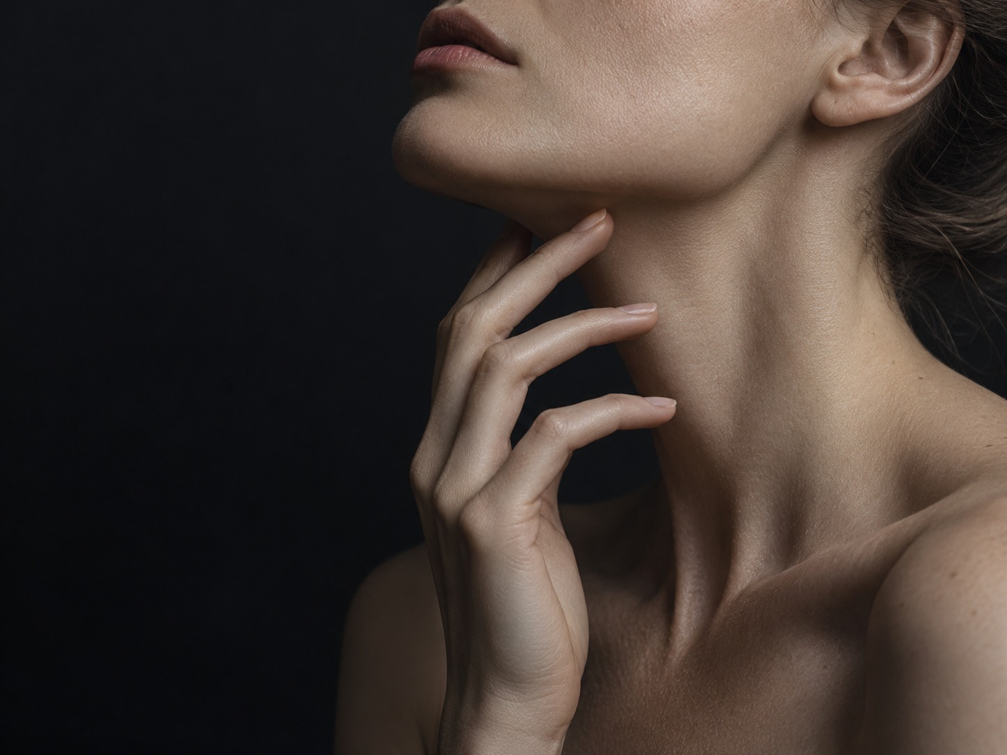 Sculptural beauty portrait with soft light on natural skin